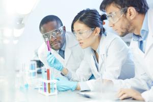 Scientists examining a test tube.